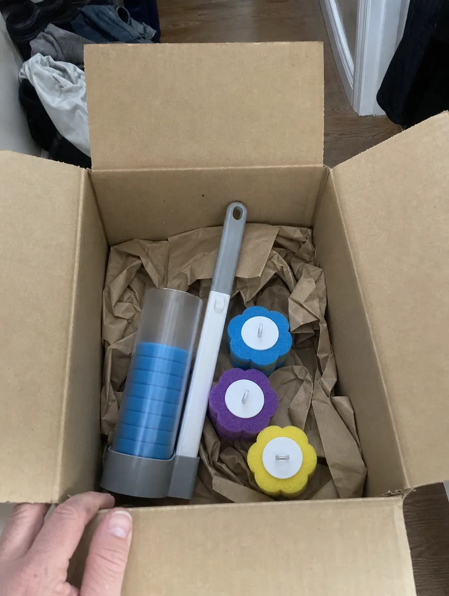 TossClean kit unboxed in a shipping box